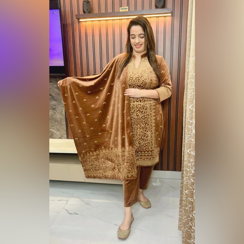 Light brown velvet suit with leather patchwork. Glitter on shirt and dupatta.